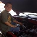 Devin helping Dad at the shop