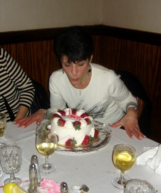 Nina blowing candles