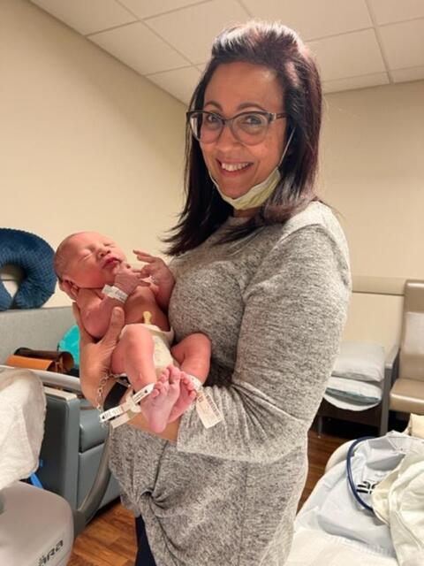 Beautiful proud grandma with Baby Adriel